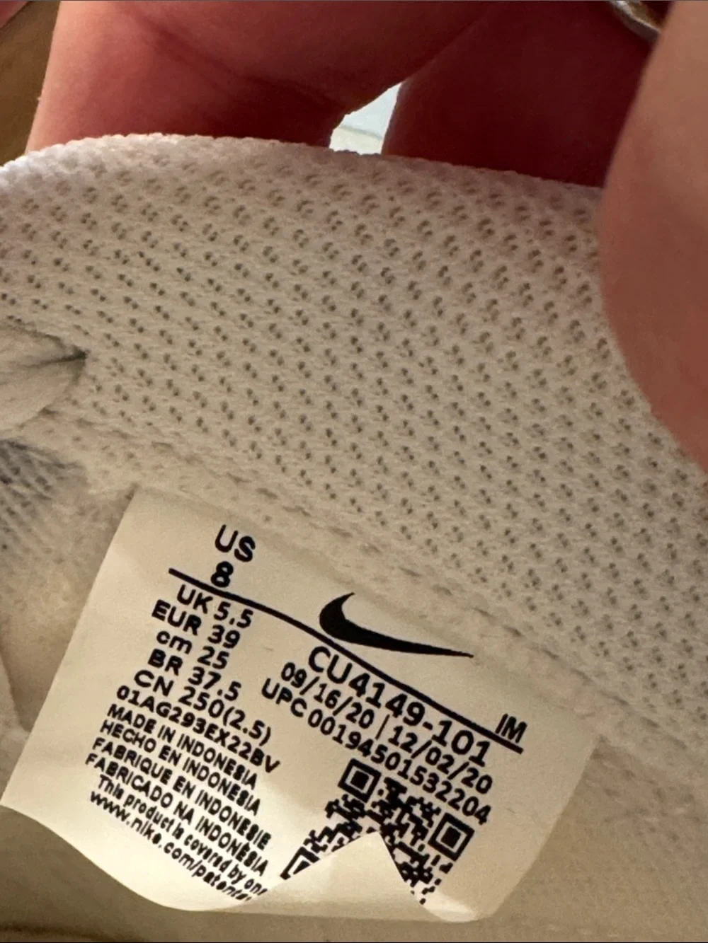 Nike White Low-Top Sneakers with Red Tongue Logo